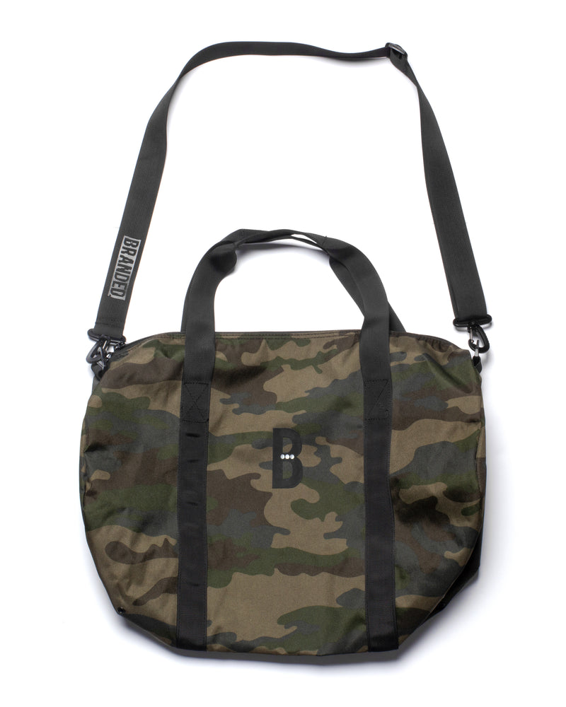 
                  
                    Load image into Gallery viewer, BLOGO CAMO DUFFEL BAG.
                  
                