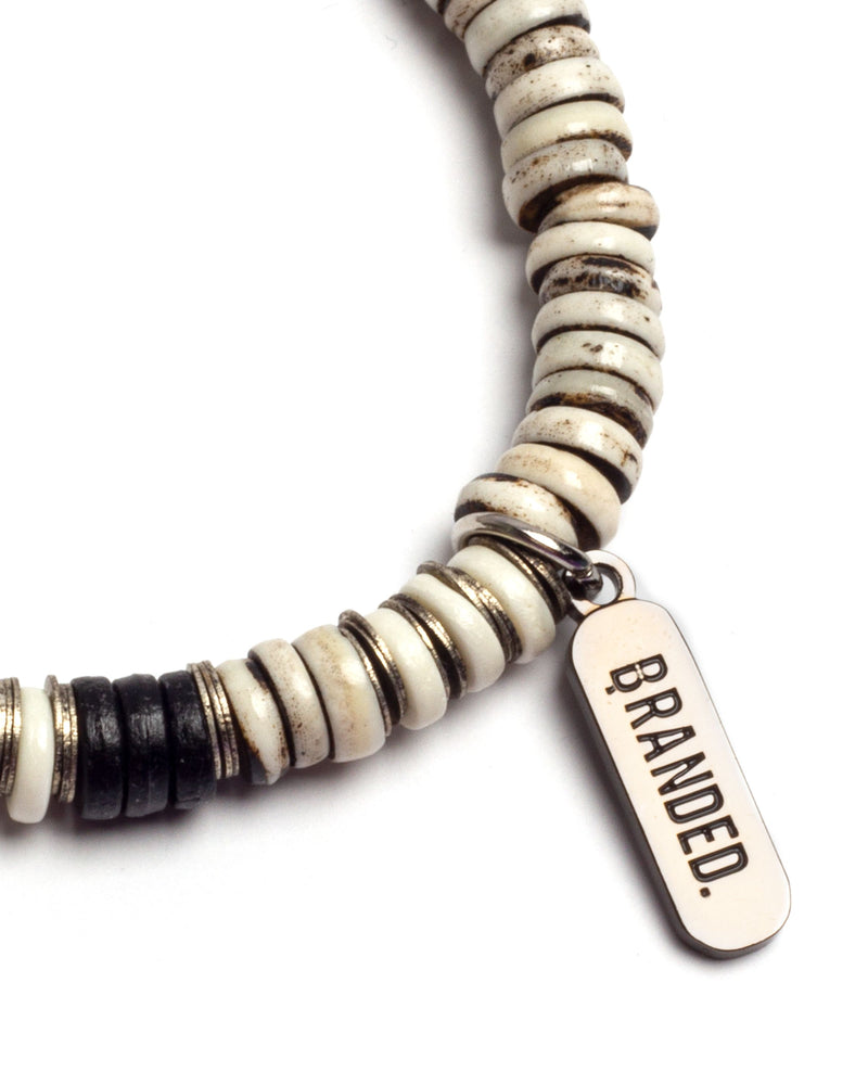 
                  
                    Load image into Gallery viewer, BRANDED. BONE BUTTON BRACELET. (GREY)
                  
                
