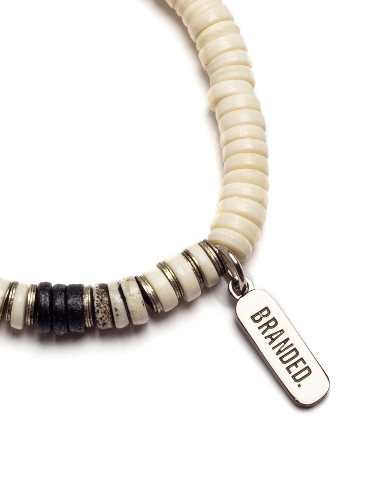 
                  
                    Load image into Gallery viewer, BRANDED. BONE BUTTON BRACELET (WHITE/IVORY)
                  
                